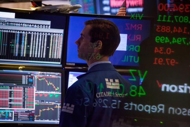 © Bloomberg. A trader works on the floor of the New York Stock Exchange (NYSE) in New York, U.S., on Friday, March 2, 2018. U.S. stocks fell, with megacaps bearing the brunt of selling, while Treasuries slipped with the dollar as investors assessed the impact of a potential trade war.