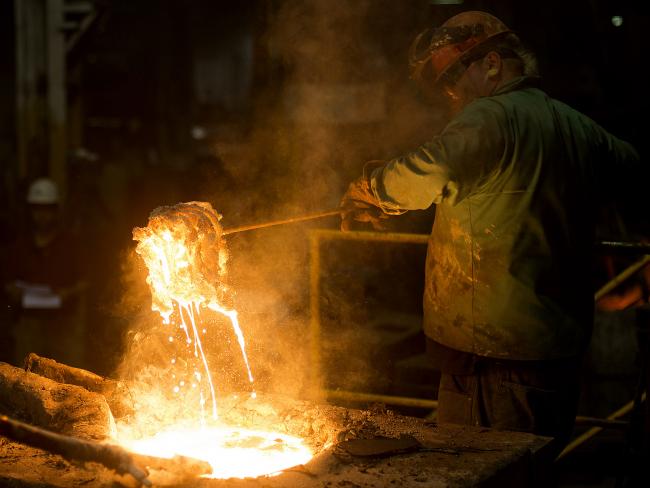 © Bloomberg. A worker removes slag, a stony waste substance created from the smelting process, from molten metal in a ladle at a facility in Salem, Ohio. Photographer: Ty Wright/Bloomberg
