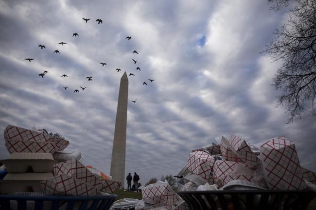 &copy Bloomberg. Full garbage cans stand near the Washington Monument on the National Mall in Washington, D.C. on Dec. 23, 2018. 
