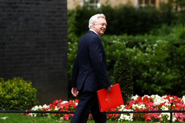 © Bloomberg. David Davis, U.K. exiting the European Union (EU) secretary, leaves after attending a meeting of cabinet minsters at number 10 Downing Street in London, U.K., on Tuesday, June 5, 2018. U.K. businesses told Prime Minister Theresa May to get on with taking key Brexit decisions as companies start putting their contingency plans in place, according to a person at a meeting at her London office on Monday. 