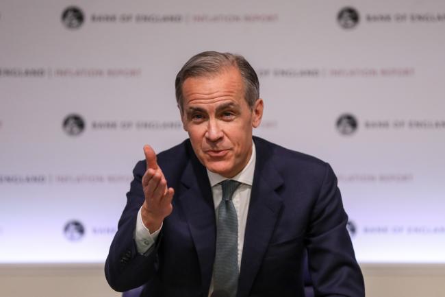 © Bloomberg. Mark Carney, governor of the Bank of England (BOE), gestures while speaking during the bank's quarterly inflation report news conference at the central bank in the City of London, U.K., on Thursday, May 2, 2019. The BOE signaled that the market is slightly underpricing the outlook for interest-rate increases over the next three years as long as Brexit goes smoothly. Photographer: Chris Ratcliffe/Bloomberg
