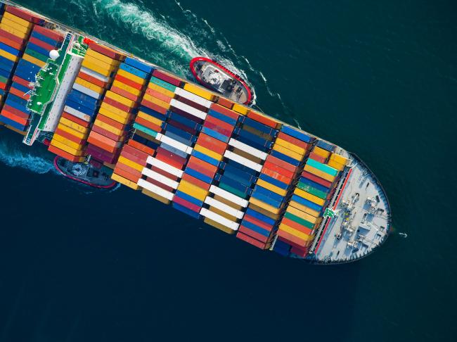 © Bloomberg. Tugboats help guide a Mediterranean Shipping Co. (MSC) ship loaded with freight containers in this aerial photograph approaching the Port of Long Beach in Long Beach, California, U.S., on Friday, Feb. 1, 2013. The U.S. Census Bureau is scheduled to release trade balance figures on Feb. 8. Photographer: Tim Rue/Bloomberg