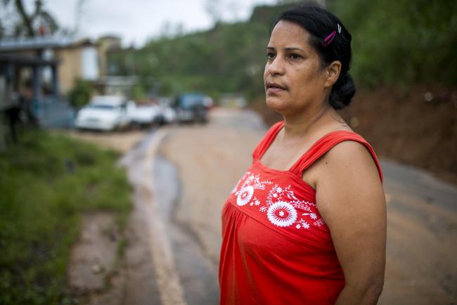 © Bloomberg. 18 October, 2017. Barranquitas, Puerto Rico.Visit the town of Barranquitas almost a month after Hurricane Maria struck Puerto Rico to document what progress has been made and how they are surviving. Barranquitas is a town that remains in the mountainous zone of Puerto Rico. The towns of the center of the island were the most affected by Hurricane Maria. Today, October 18, 2017.In the photo: Erika Perez, 43, and Eduardo Colon, 42, their children Alondra Marie Colon, 14, and Jan Eduardo Colon, 13, are residents of the Quebradilla neighborhood of Barranquitas. They had a plantain farm, and this was their sustenance until Hurricane Maria destroyed. After that they have been affected by the thefts of their fruits and seeds. They do not have electricity, only non-potable water. They have requested help to the Municipality of Barranquitas to help them to remove the landslides but to date they have not received such assistance to almost a month of Hurricane Maria. They fear that if the rains continue there may be more landslides.In the photo: Erika Perez Xavier Garcia / Bloomberg 
