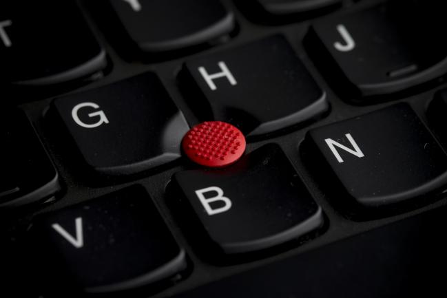 &copy Bloomberg. A Lenovo Group Ltd. trackpad button is displayed on a Lenovo ThinkPad T440s keyboard at the company's store in the Sha Tin district of Hong Kong, China, on Friday, Feb. 7, 2014.  