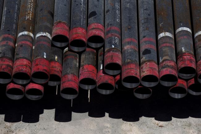 © Bloomberg. Oil drill pipe casings sit at a Colgate Energy LLC site in Reeves County, Texas, U.S., on Wednesday, Aug. 22, 2018. Spending on water management in the Permian Basin is likely to nearly double to more than $22 billion in just five years, according to industry consultant IHS Markit. Photographer: Callaghan O'Hare/Bloomberg