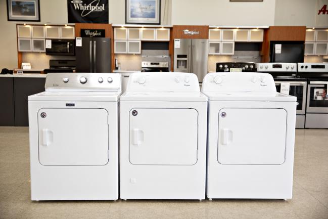 © Bloomberg. Whirlpool Corp. dryers sit on display for sale at the Valley Appliance Sales store in Peru, Illinois, U.S. Photographer: Daniel Acker/Bloomberg