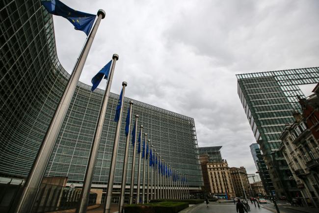 © Bloomberg. European Union (EU) flags fly outside the Berlaymont building in Brussels, Belgium, on Thursday, Sept. 28, 2017. EU Chief Negotiator Michel Barnier said it will take âweeks or monthsâ before Brexit talks can move on to trade, even as he welcomed a new âdynamicâ in negotiations this week.