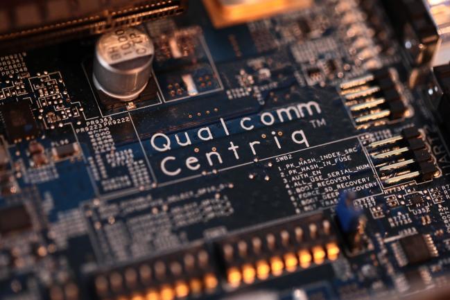 © Bloomberg. Qualcomm Centriq branding sits on a motherboard on display at the Qualcomm Inc. stand during day two of the Mobile World Congress (MWC) in Barcelona, Spain, on Tuesday, Feb. 27, 2018. At the wireless industry's biggest conference, more than 100,000 people are set to see the latest smartphones, artificial intelligence devices and autonomous drones exhibited by roughly 2,300 companies.