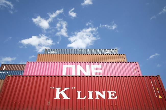 © Bloomberg. Shipping containers sit stacked at a terminal in Tokyo, Japan, on Thursday, March 14, 2019. Japan is scheduled to release trade figures on March 18. 