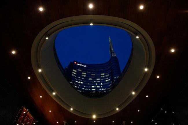 © Bloomberg. The UniCredit SpA headquarters stands in Milan, Italy, on Monday, Sept. 25, 2017. The Italian government sees the country's debt load starting to fall this year as the economy heads into a three-year stretch of 1.5 percent annual growth. Photographer: Stefan Wermuth/Bloomberg