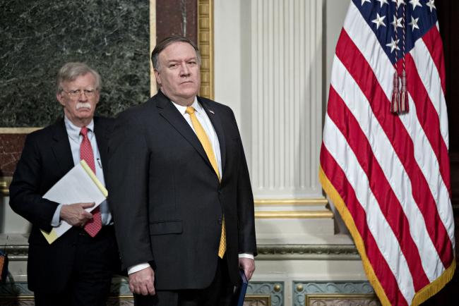 © Bloomberg. John Bolton, left, and Mike Pompeo. Photographer: Andrew Harrer/Bloomberg 