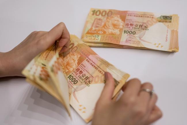 Hong Kong Dollar Weakens As Worst Of Cash Squeeze Seen Ending By Bloomberg