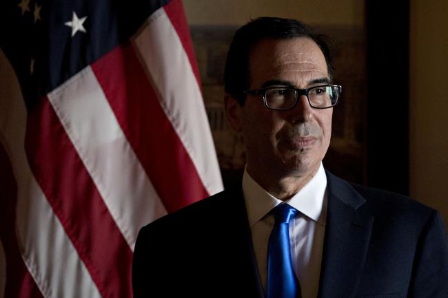 © Bloomberg. Steven Mnuchin, U.S. Treasury secretary, listens during a signing ceremony event at the U.S. Treasury in Washington, D.C, U.S., on Wednesday, Oct. 17, 2018. The Treasury plans to triple the size of an emergency swap line for Mexico to $9 billion, giving the Latin American nation more of a financial cushion as emerging markets come under pressure from rising U.S. interest rates. Photographer: Andrew Harrer/Bloomberg