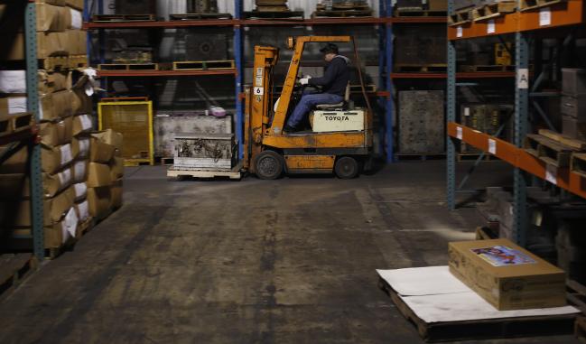 © Bloomberg. A warehouse worker drives a forklift at the J.K. Manufacturing Co. facility in Kalkaska, Michigan U.S., on Wednesday, Dec. 7, 2016. The U.S. Census Bureau is scheduled to release business inventories figures on December 14.