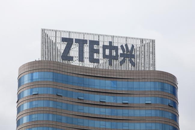© Bloomberg. Signage is displayed atop the ZTE Corp. headquarters in Shenzhen, China, on Monday, June 4, 2018. ZTE, the Chinese telecom company that's become a focal point of the nation's trade dispute with the U.S., last week replaced one of its most powerful executives in a move that may signal efforts to placate American demands. Photographer: Giulia Marchi/Bloomberg