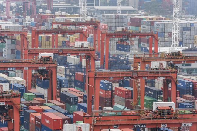 &copy Bloomberg. Shipping containers sit stacked among remote-controlled gantry cranes in Container Terminal 9, operated by Hong Kong International Terminal (HIT) - a unit of CK Hutchison Holdings Ltd., at Kwai Tsing Container Terminals in Hong Kong, China, on Tuesday, Jan. 30, 2018. The new system features increases efficiency, enhanced occupational safety, and an improved working environment for crane operators, according to the company.