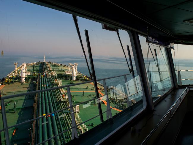 © Bloomberg. The crude oil tanker 'Devon' sails through the Persian Gulf towards Kharq Island to transport crude oil to export markets in the Persian Gulf, Iran, on Friday, March 23, 2018. Geopolitical risk is creeping back into the crude oil market. Photographer: Ali Mohammadi/Bloomberg