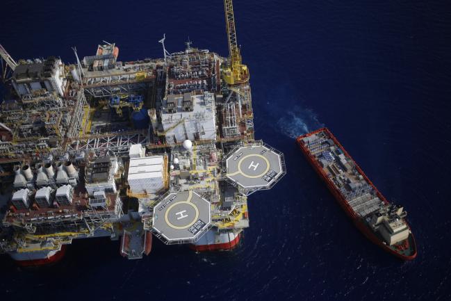 © Bloomberg. The Kobe Chouest platform supply vessel sits anchored next to the Chevron Corp. Jack/St. Malo deepwater oil platform in the Gulf of Mexico in the aerial photograph taken off the coast of Louisiana, U.S., on Friday, May 18, 2018. While U.S. shale production has been dominating markets, a quiet revolution has been taking place offshore. The combination of new technology and smarter design will end much of the overspending that's made large troves of subsea oil barely profitable to produce, industry executives say. Photographer: Luke Sharrett/Bloomberg