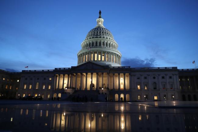 © Bloomberg. The U.S. Capitol stands at sunset in Washington, D.C., U.S., on Tuesday, Feb. 5, 2019. President Donald Trump will speak to a House chamber full of Democrats jostling to challenge his re-election on Tuesday night, with many female lawmakers planning to dress in suffragette white and his chief antagonist Nancy Pelosi seated at the dais behind him. 