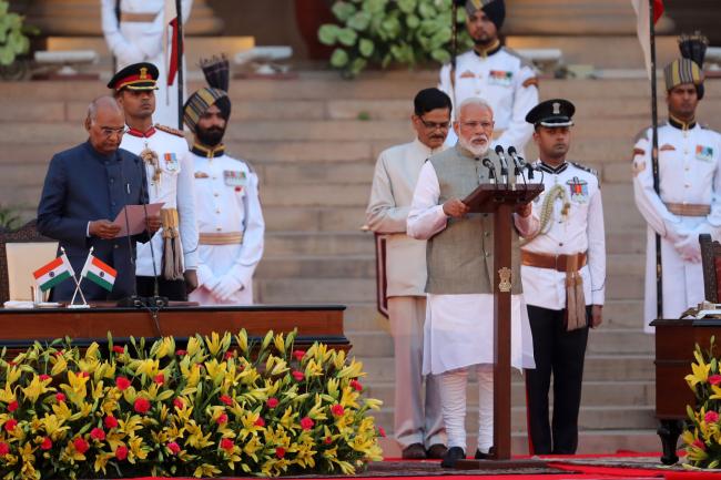 © Bloomberg. Narendra Modi speaks during a swearing in ceremony on May 30. Photographer: T. Narayan/Bloomberg