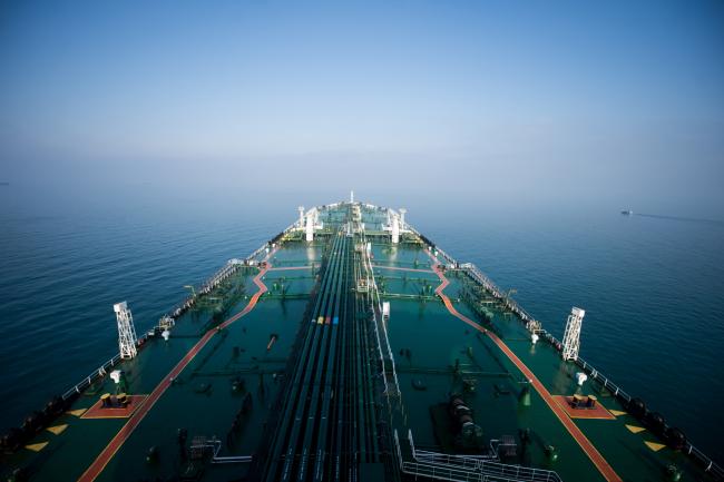 © Bloomberg. The crude oil tanker 'Devon' sails through the Persian Gulf towards Kharq Island to transport crude oil to export markets in the Persian Gulf, Iran, on Friday, March 23, 2018. Geopolitical risk is creeping back into the crude oil market. Photographer: Ali Mohammadi/Bloomberg
