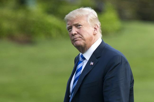 © Bloomberg. U.S. President Donald Trump walks on the South Lawn of the White House in Washington, D.C., U.S., on Friday, May 4, 2018. 