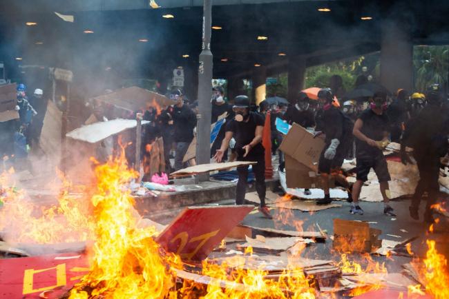 Violence on the Streets Can’t Stop Deal-Making in Hong Kong