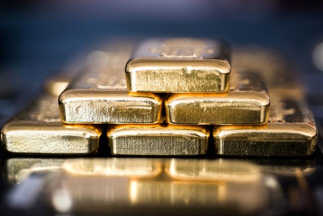 © Bloomberg. Gold bars sit stacked in this arranged photograph in Hungary. Photographer: Bloomberg Creative Photos/Bloomberg
