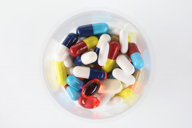 © Bloomberg. Brightly coloured pharmaceutical medication, including antibiotics, paracetamol, Ibuprofen and cold relief tablets, manufactured by a variety of companies sit in this arranged photograph in London, U.K., on Friday, April 27, 2018. Pharmaceutical companies may see approval times cut to 14 months vs. 19 and about $370 million of sales brought forward per antibiotic after global regulators aligned rules to combat bacterial resistance. 