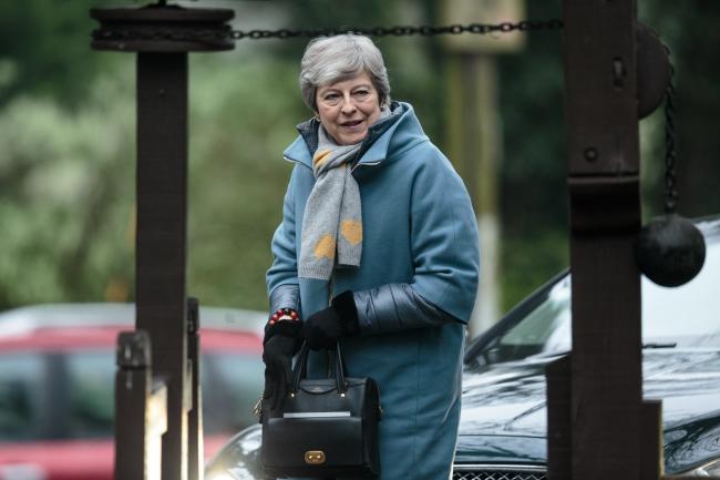 © Bloomberg. AYLESBURY, ENGLAND - APRIL 07: British Prime Minister Theresa May arrives for a Sunday church service on April 7, 2019 in Aylesbury, England. Mrs May has been criticised by some members of the Conservative party for reaching out to Labour leader Jeremy Corbyn in an attempt to deliver Brexit. (Photo by Jack Taylor/Getty Images)