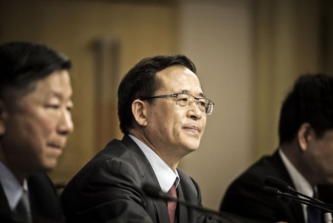 © Bloomberg. Liu Shiyu, chairman of the China Securities Regulatory Commission (CSRC), looks on during a news conference on the sidelines of the fourth session of the 12th National People's Congress (NPC) in Beijing, China, on Saturday, March 12, 2016. China's new stock regulator vowed to step in “decisively” if needed to stem the sort of stock-market panic that resulted in a $5 trillion wipeout last summer, adding that it was far too early to think about the state rescue fund leaving the market. Photographer: Qilai Shen/Bloomberg *** Local Caption *** Liu Shiyu
