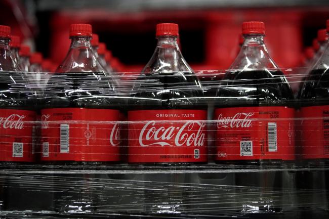 © Bloomberg. Bottles of Coca-Cola Co. brand soda sit ready for shipment at the Swire Coca-Cola bottling plant in West Valley City, Utah, U.S., on Friday, April 19, 2019. The Coca-Cola Co. is scheduled to release earnings figures on April 23. 
