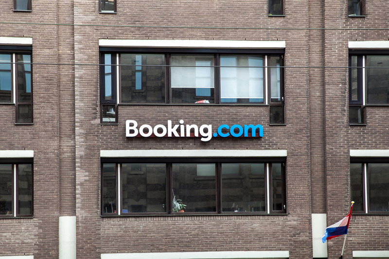Booking Earnings, Revenue Beat in Q4
