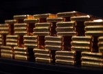 PRECIOUS-Gold holds near 9-month low as yields, dollar gain further