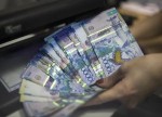Empresários cazaques defendem contenção da volatilidade do tenge
