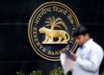 UPDATE 1-India's cenbank eases bank lending limits to some non-banking finance firms