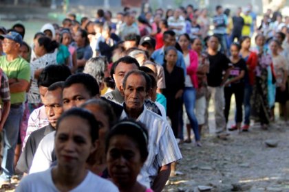 East Timorese form long lines to vote in parliamentary election