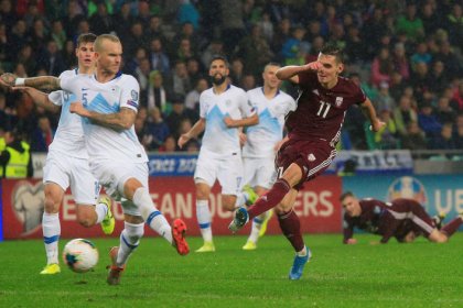 Own goal keeps Slovenia's faint hopes alive
