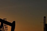 Oil slips on oversupply fears, but stocks jump on virus slowdown hopes