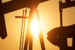 Oil rises as hopes build for global production cut