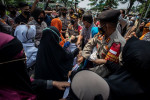 Influential Indonesian cleric accused of incitement over celebrated homecoming