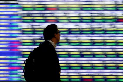 Stocks turn mixed, dollar faces rate hike uncertainty