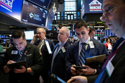 Wall St. edges higher as tech boost counters losses in bank stocks