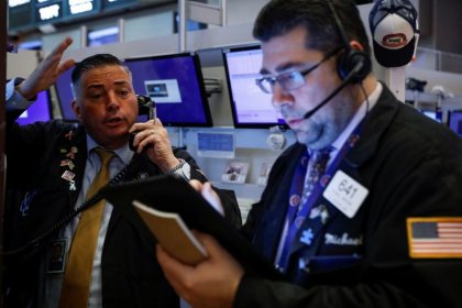 Stocks, oil tumble; gold spikes as virus fears grip markets