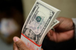 Dollar drops as yield support fades amid expectations of low U.S. rates