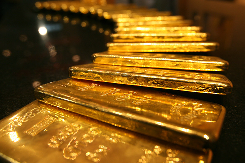 Gold prices fell on a firmer dollar on Wednesday