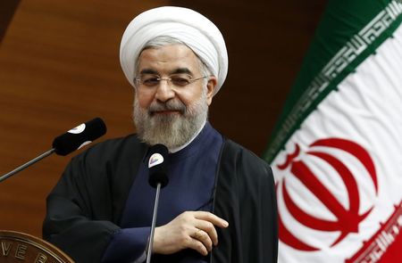 © Reuters. Rouhani addresses the audience during a meeting in Ankara