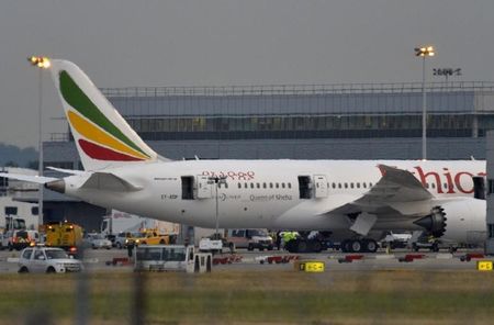 © Reuters. Emergency services attend to a Boeing 787 Dreamliner, operated by Ethiopian Airlines, after it caught fire at Britain's Heathrow airport