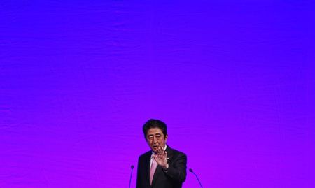 © Reuters. File photo of Japan's PM Abe delivering a speech during the ruling Liberal Democratic Party annual convention in Tokyo