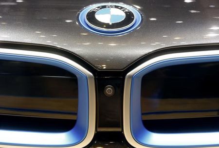 © Reuters. A lens of a camera system is placed between the radiator grills of a BMW 8i coupe car during the media day ahead of the 84th Geneva Motor Show at the Palexpo Arena in Geneva